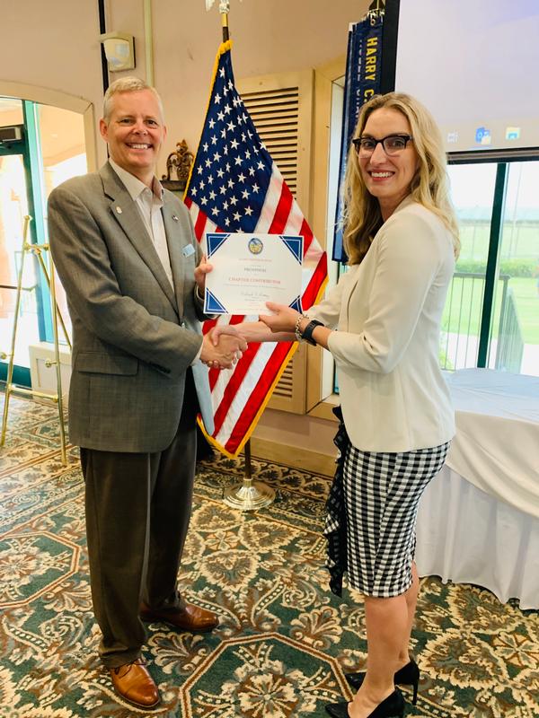 Shannon Hattersley, vice president, Prosphere, accepts the Chapter Contributor certificate from Chapter President Rick Lipsey during the July luncheon. Corporate sponsorships allow the chapter to offer free admission and lunch to military and Department of Defense employees.