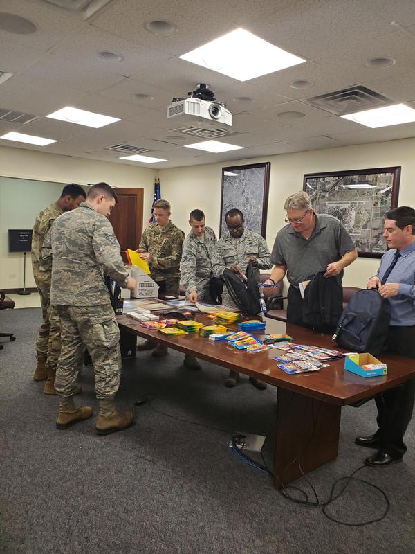 Members pack school supplies during the August event. The chapter provides the funding for the supplies that will be given to local military and community students in need.