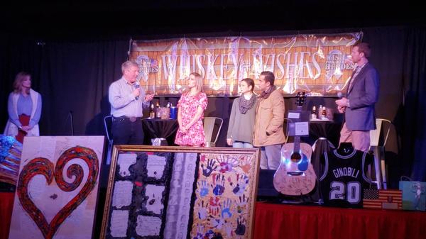 In April, Brig. Gen. Jeff Kendall, USAF (Ret.), chapter vice president of veteran support and military family outreach, presents a check during the 2019 Whiskey  and  Wishes Heroes Gala to assist a military family in need. Amidst this pandemic, there is a growing need for aid to our aging veterans. 