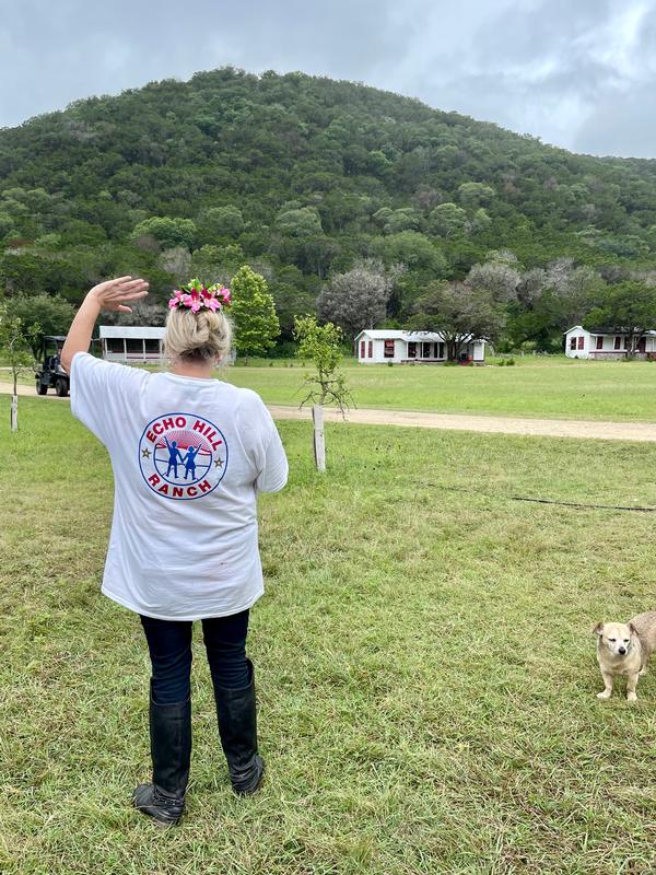 Marcie Friedman, daughter of Echo Hill Ranch founders Thomas and Minnie Friedman, waves to a few counselors during their Gold Star Kids Camp in July.