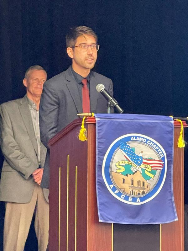 Sean Garnsey, student, University of Texas at San Antonio, and recipient of the Dr. Ralph W. Shrader Graduate Diversity Scholarship, speaks to the August luncheon attendees about the Chamorro people of Guam. 