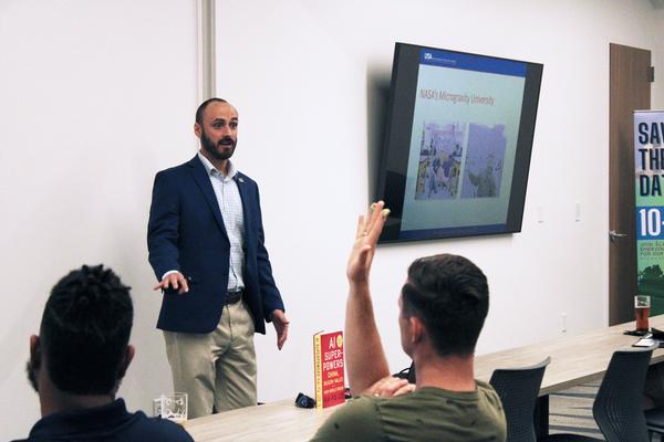 In July, Garrett Hall, research engineer with Southwest Research Institute, Defense and Intelligence Solutions Division, presents during the Tech on Tap social event.
