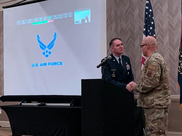 Chapter Vice President of Programs Col. Omar Velasco, USAF, thanks guest speaker Col. Rockhill during the monthly chapter luncheon in September.