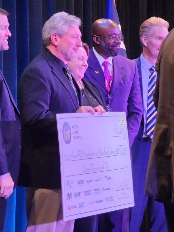 The chapter's Wounded Warrior and Military Endowment Fund receives donations from multiple sponsors at the November event.