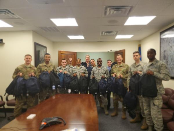 Members of the August Build-A-Backpack event hosted by the Joint Base San Antonio Raptor Booster Club pause for a photo.