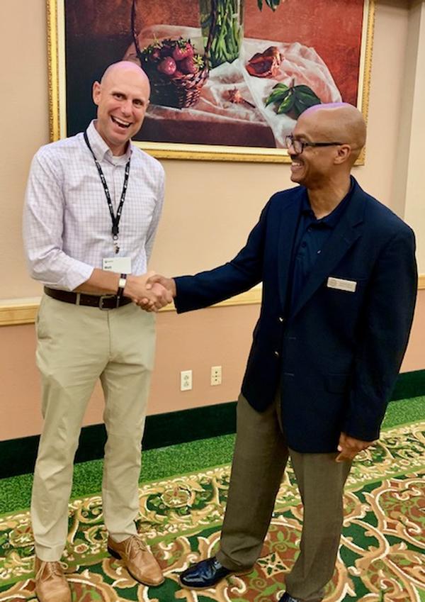 Charles Brice, chapter vice president of education (r), thanks Derek Ditch, chief operating officer and co-founder of Perched, for coming out to train the chapter's members and attendees at the September event. Lunch and Learn opportunities are available to members and space permitting, nonmembers.