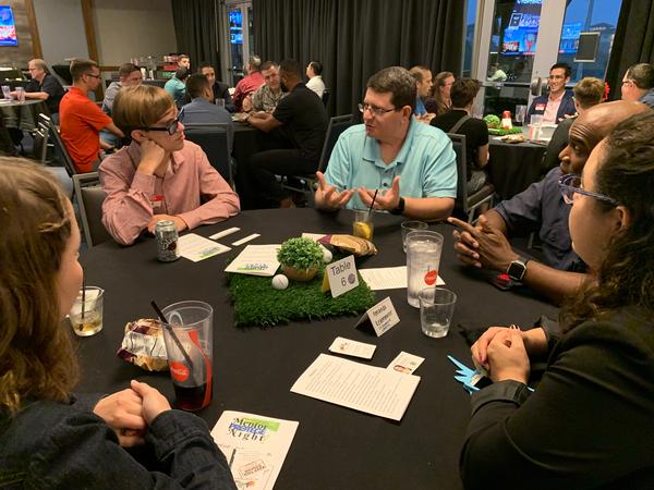 Ethan Riley from GhostWire Academy (l) talks with a mentor, Lt. Col. Jonathan Joshua, USAF, deputy chief of staff, 24th Air Force, during the speed networking portion of the October event.