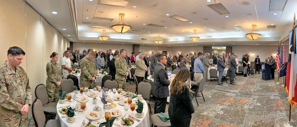 Chapter Vice President of Corporate Sponsors Tom Allen leads the invocation for members and attendees of the February luncheon.