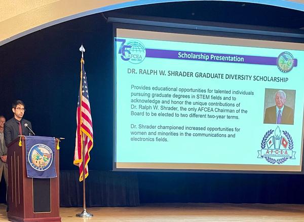 Garnsey accepts the AFCEA Education Foundation Dr. Ralph W. Shrader Graduate Diversity Scholarship during the chapter's August monthly luncheon held at the Randolph Air Force Base Parr Club.