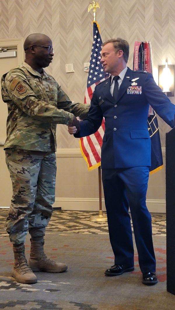 Col. Lamont Atkins, USAF, chapter vice president of programs, thanks Col. Drake for speaking at the March event.