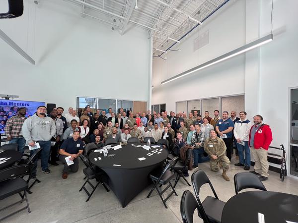 Mentors and mentees pose for a photo at the January event.
