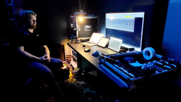 An engineer runs conference behind-the-scenes technology at Alamo ACE in November.