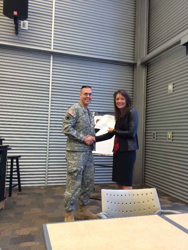 In January, Lt. Col. David Elder, USA, chapter president, recognizes Elekta Keen, a corporate chapter liaison with AT&T, for her contributions to the chapter.