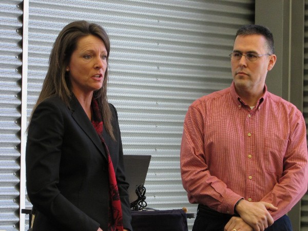 Kean discusses the donation with members before the presentation to Elder in January.