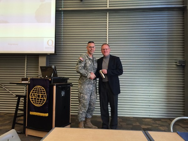 Hans Roeterink, chief operating officer of Quintillion Networks, receives a certificate of appreciation from Col. Elder at the February luncheon recognizing his support of the chapter.