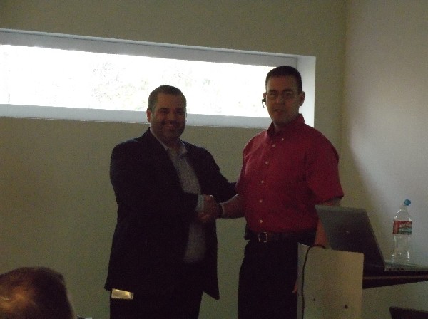 Lt. Col. David Elder, USA (Ret.), chapter president (r), thanks Bock of Verizon for presenting to the chapter in October.