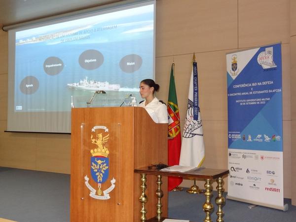 Cadet Matilde Vieira delivers a presentation about the integration of a landing support system for UAVs on ships during the September meeting.