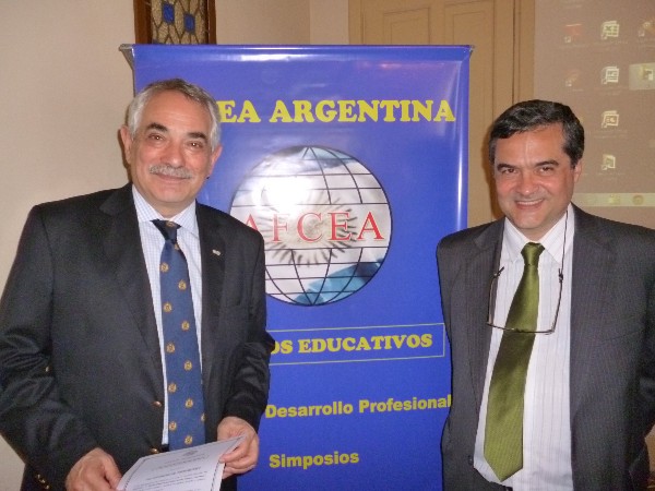 In December, guest speaker Bachelor Osvaldo Nemirovsci (l), General Advisory Council of Digital TV, receives a certificate of appreciation from Eng. Luis Valle.