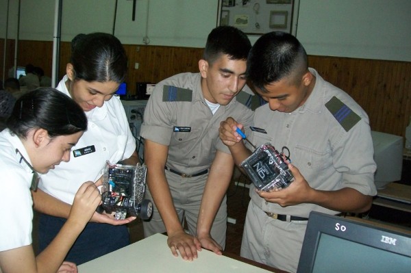 Cadets work on components of a robot during an educational activity in May made possible by a Science Teaching Tools grant.