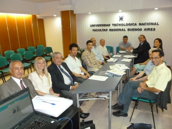 Chapter board members and IEEE members gather during the December ceremony where the organizations signed an agreement allowing for joint conduct educational events.