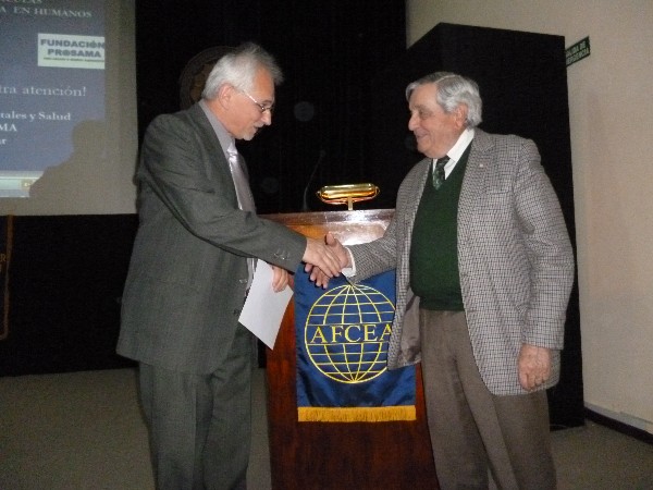 Rear Adm. Emilio Nigoul, ARA (Ret.), chapter president, presents a certificate of recognition to Jorge Herkovitz (l), Ph.D., at the October Nanotechnology Symposium.