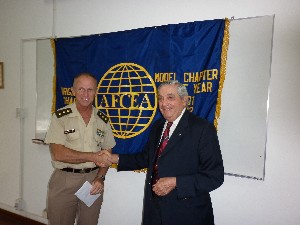 In December, Rear Adm. Emilio Nigoul, ARA (Ret.) (r), chapter president, presents a Science Teaching Tools award to Col. Javier Marturet, EA, secretary of high education at the Military Lyceum.