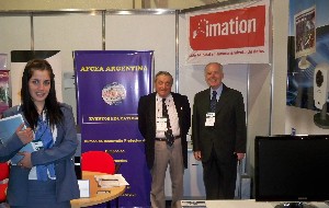 Rear Adm. Emilio Nigoul, ARA (Ret.) (l), chapter president, and Col. Hugo Cargnelutti, EA (Ret.), chapter secretary, assist with the chapter's exhibit at the 2011 Symposium on Defense Research and Production in September.