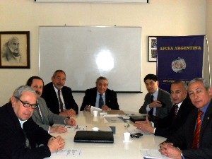 Rear Adm. Emilio Nigoul, ARA (Ret.) (c), chapter president, and Juan Carlos Fondevila Sancet (l), regional vice president, join other chapter leaders to sign an agreement with Microsoft, represented by Eduardo Seco (r), director of the company's public sector.