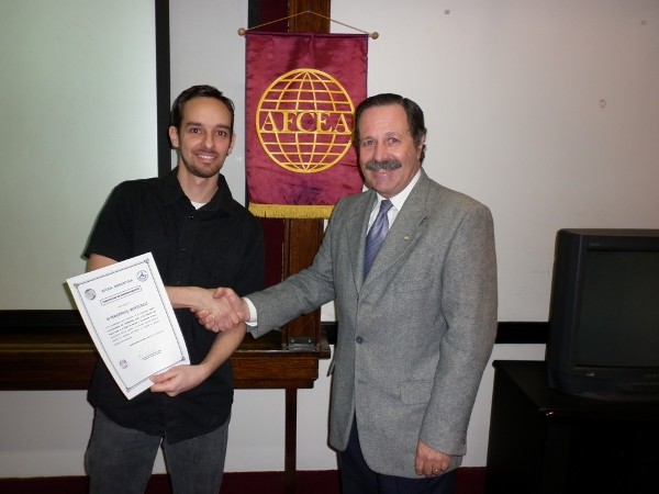 Maj. Gen. Norberto Dimeglio, FAA (Ret.) (r), chapter first vice president, presents a certificate of appreciation to Monticelli for his speech in May.