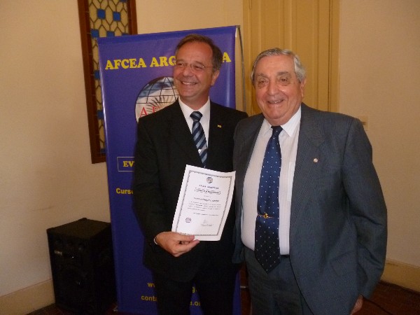 In October, Rear Adm. Emilio Nigoul, ARA (Ret.) (r), chapter president, presents a certificate of appreciation to Julio Fumagalli Macrae, vice president, South America Area of ASIS International.