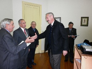 Adm. Nigoul (l) presents a certificate to an attendee at the chapter's symposium on network centric warfare in June.
