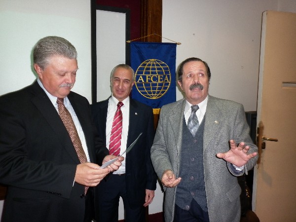 In August, Maj. Gen. Norberto Dimeglio, FAA (Ret.) (r), chapter first vice president, presents a certificate of recognition to Martino (l) while Luis Alberto Favotto, chapter board member, looks on.