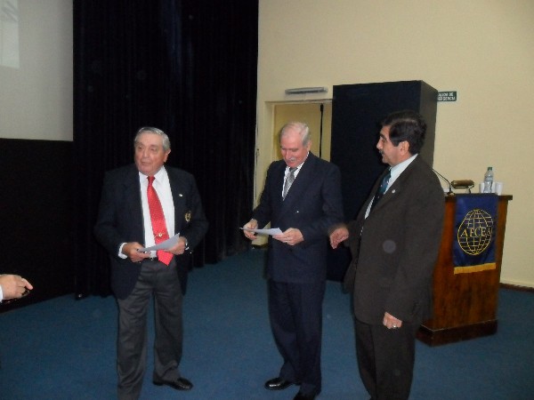 In May, Rear Adm. Eduardo Castro Rivas, ARA (Ret.) (c), receives a certificate of recognition from Adm. Nigoul (l) and Col. Tello.
