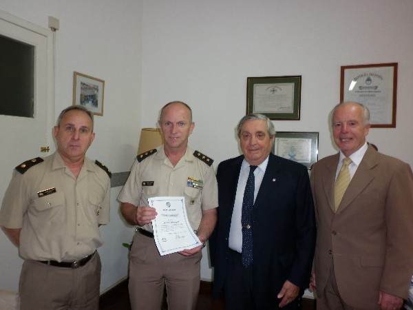 Gathering for the Science Teaching Tools Award presentation in December are (l-r) Lt. Col. Raul Cantaluppi, EA, head of education for the Army; Col. Marturet; Adm. Nigoul; and Col. Hugo Cargnelutti, EA (Ret.), chapter secretary.