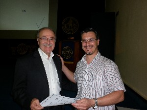 Daniel Lupi (l), president of the Argentina Foundation of Nanotechnology, presents a certificate of recognition to Marcelo Pagnola, Ph.D., National University of Buenos Aires, in November.