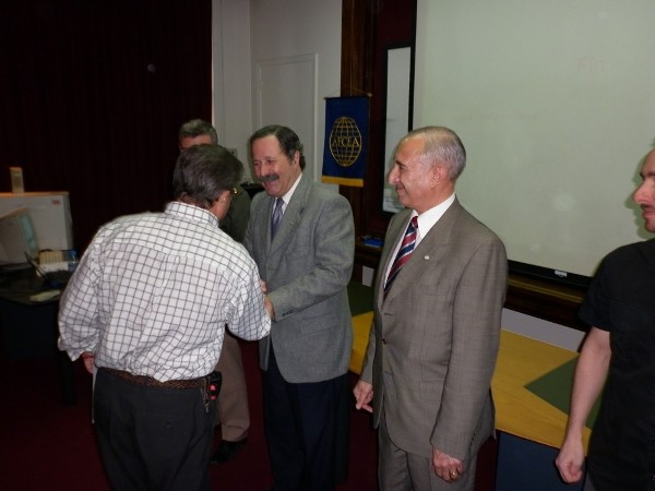 Maj. Gen. Dimeglio (c) presents a certificate to an attendee of the chapter's May conference.