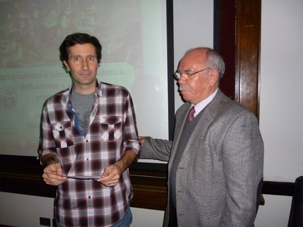 In June, Miguel A. Larotonda, Ph.D., division chief at the Institute for Scientific and Technological Research of the Armed Forces (l), receives a certificate of recognition from Col. Oscar Gonzalez, FAA (Ret.), chapter first vice president.
