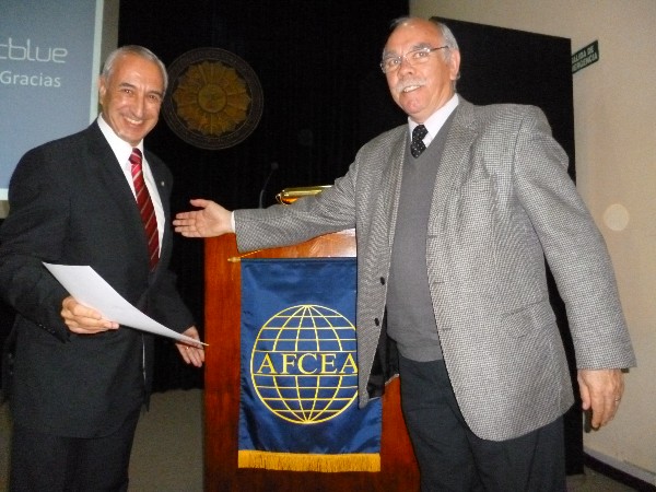 Luis Favotto (l) receives a certificate of recognition from Col. Oscar Gonzalez, FAA (Ret.), chapter first vice president, at the October Nanotechnology Symposium.