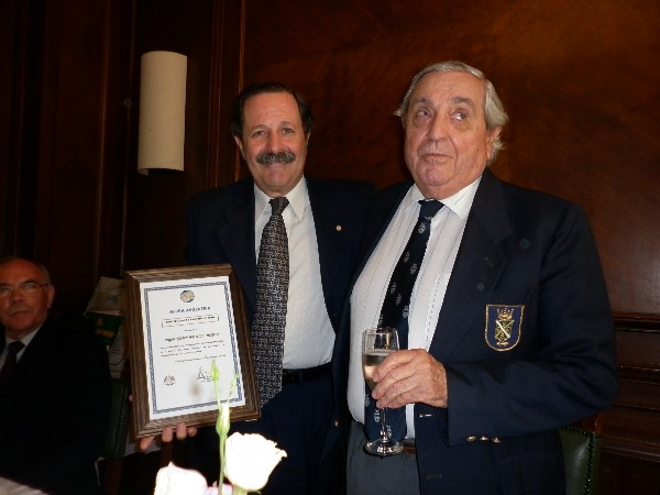 In December, Rear Adm. Emilio Nigoul, ARA (Ret.) (r), chapter president, presents a farewell certificate to Maj. Gen. Norberto Dimeglio, FAA (Ret.), chapter first vice president, who resigned for personal reasons.