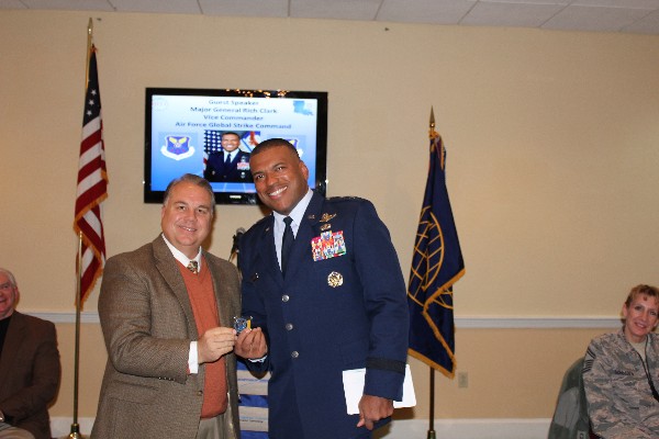Maj. Gen. Richard Clark, USAF (r), accepts the chapter coin from Chapter Executive Vice President Kevin Smith at the November luncheon.