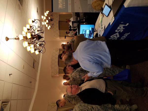 Personnel from Barksdale Air Force Base, Louisiana, visit booths at the sixth annual Technology Exposition in March.