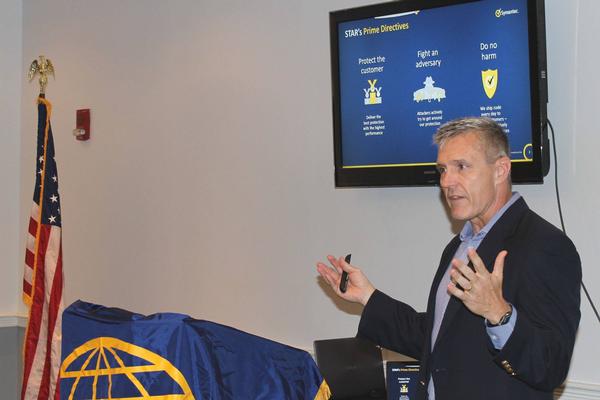Col. Andrew (Andy) Gale, USAF (Ret.), senior director, government affairs and infrastructure solutions, Symantec, talks about the directives of Symantec's Security Technology and Respond (STAR) team during the chapter's October luncheon. 