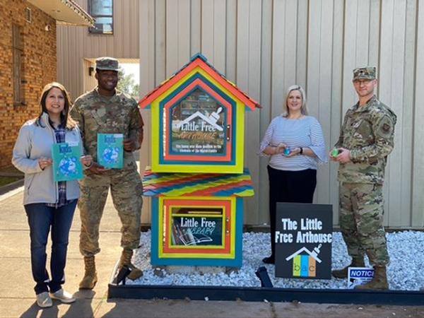 Posing for a photo at the Little Free Arthouse in November are (l to r) Brandi Pickett, chapter secretary; Capt. Kebin Umodu, USAF, chapter vice president; Robin Jones, director, Bossier Arts Council; and Lt. Col. Michael Harris, USAF, chapter president.