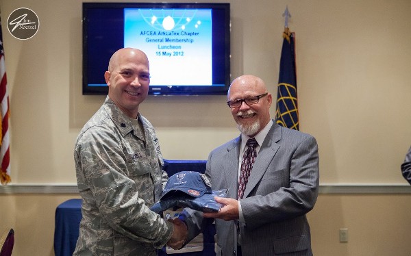 Lt. Col. Curtis Juell, USAF (l), chapter president, presents the guest speaker for May, Mike Beauford of Cloud Strike Force Federal Solutions, with tokens of the chapter's appreciation for his presentation titled “Pathway to the Cloud.”