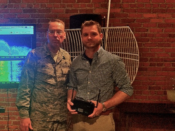 Col. Frank Simcox, USAF (l), chapter president, thanks Christopher Barber of Radiance Technologies for his cybersecurity demonstration titled “Rogue Access Points and the Dangers of Open Wi-Fi” at CoHabitat in Shreveport, Louisiana, in October.