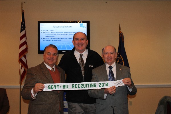 Smith (l) and Lo Walker, mayor of Bossier City, Louisiana (r), accept a ribbon for Best Government/Military Recruiting in 2014 from Texas Regional Vice President Dean Fox.