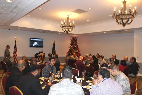 At the December luncheon, chapter members view a presentation of cyber threats to the nuclear enterprise.