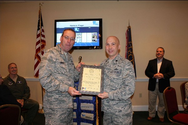 In April, Col. Simcox presents Lt. Col. Curtis Juell, USAF, past chapter president, with a plaque commemorating his induction as a lifetime AFCEA member for his significant contributions to the chapter.