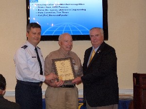 In September, Col. Charles Allen, USAF (l), chapter president, and Thomas Gwaltney (r), regional vice president, present Col. Steve dePyssler, USAF (Ret.), with an Honorary Distinguished Life Member Award from AFCEA International for more than 60 years of service.