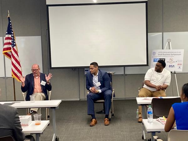 Tommy Mullins, Multiband Global (l), gives an animated response on engaging at a higher level within the government, pointing out that "going where everyone else is going, might not be the best strategy." Cameron Boli, Federal Reserve Bank (c), and Jason Johnson from MH Miles Company agreed, adding their perspectives during the July session.